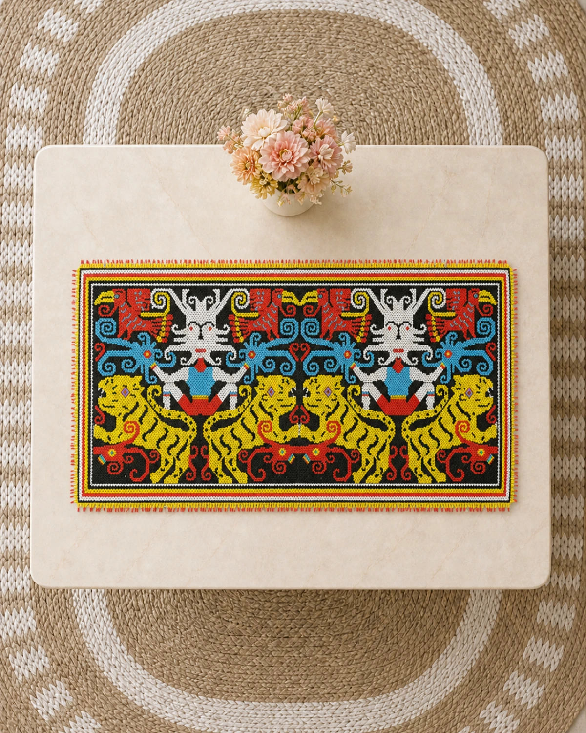 Twin Tiger Borneo beaded table runner on cream marble above an oval woven rug